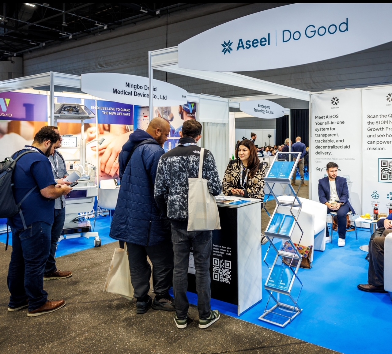 Layma sits at a booth for Aseel 