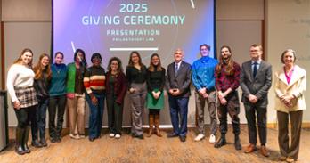 SIS professor Stephanie Fischer and students in the Philanthropy Lab class pose with Interim Dean Robinson and President Alger