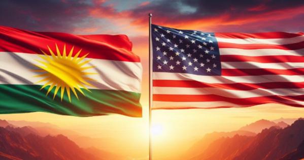 The flags of the United States and Kurdistan in front of a sunset on the mountains.