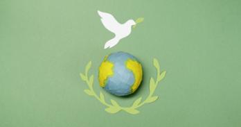Image of a dove above the globe.