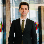 AU for American University in blue surrounded by a blue bordered box