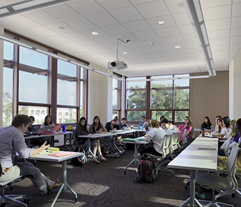Students hold a discussion with their professor in an SIS classroom.