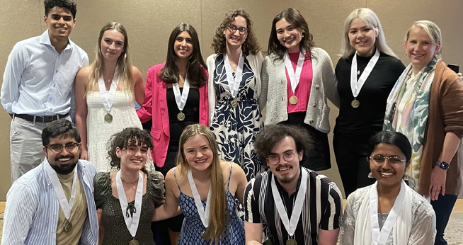 A group of SIS Honors students smile for a photo.