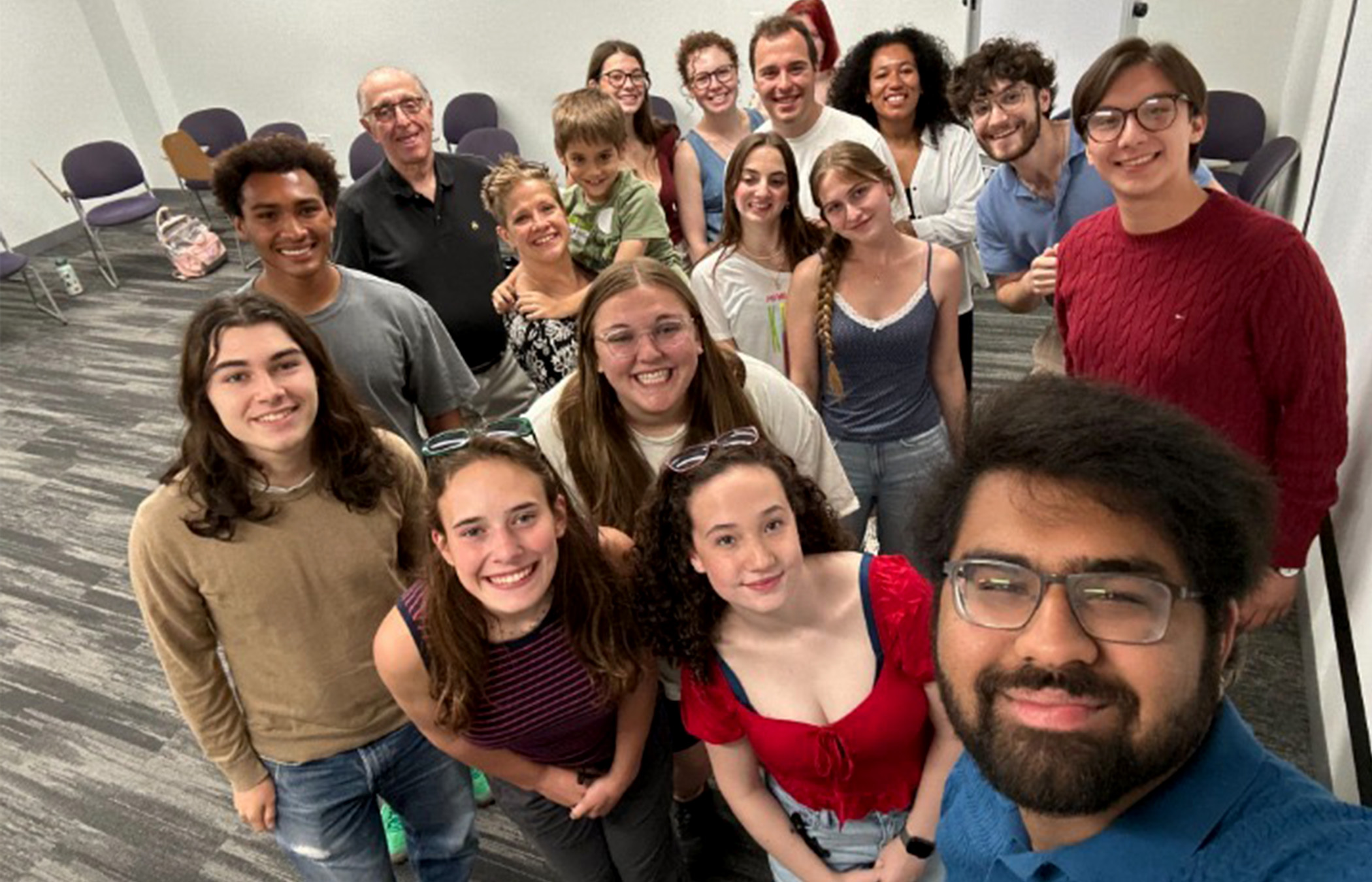 A group of Olson Scholars smile for a selfie.