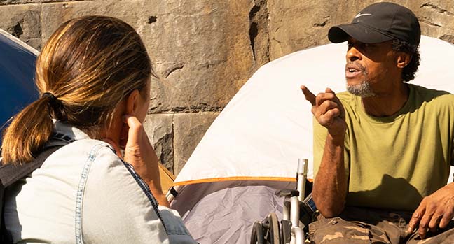 man talking to woman