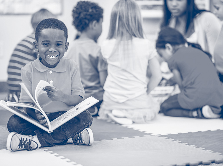 A boy flips through a book