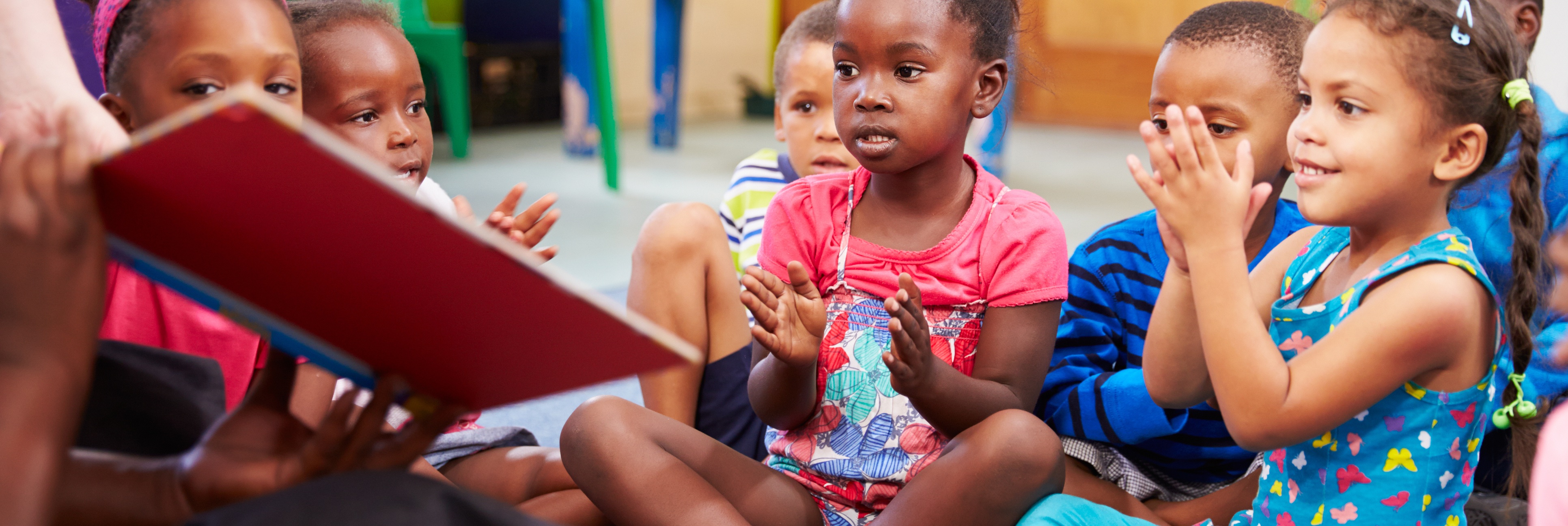 Children Reading with Teacher