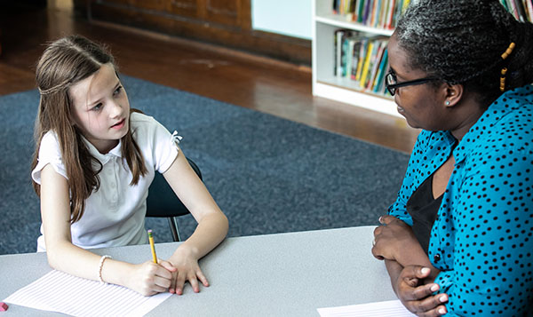 special education student with teacher