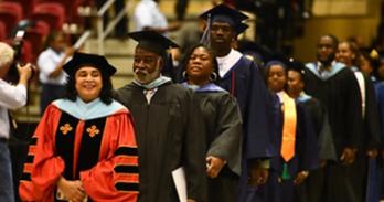 Dr. Afie Mirshah-Nayar leads the graduation procession at Largo High School in 2018.