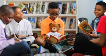 Keys at 10 years old with founding members of the book club.