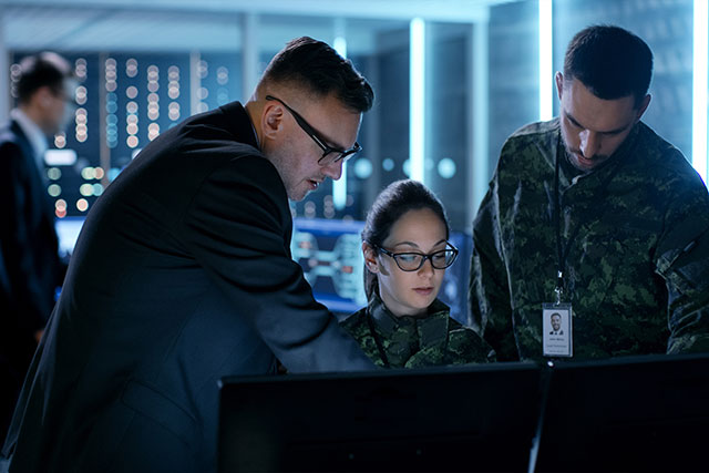 Military members working on cybersecurity task