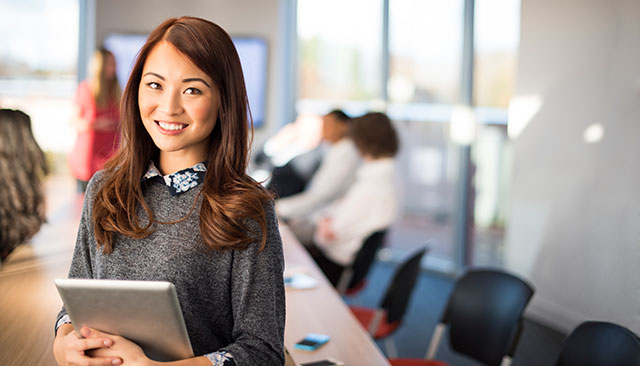 Female professional at board meeting