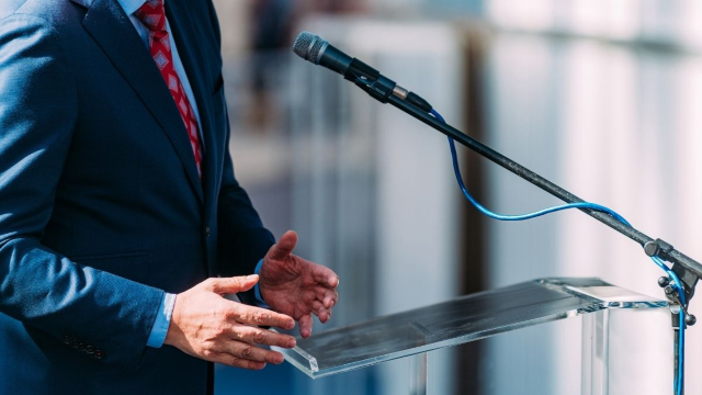 person speaking at podium