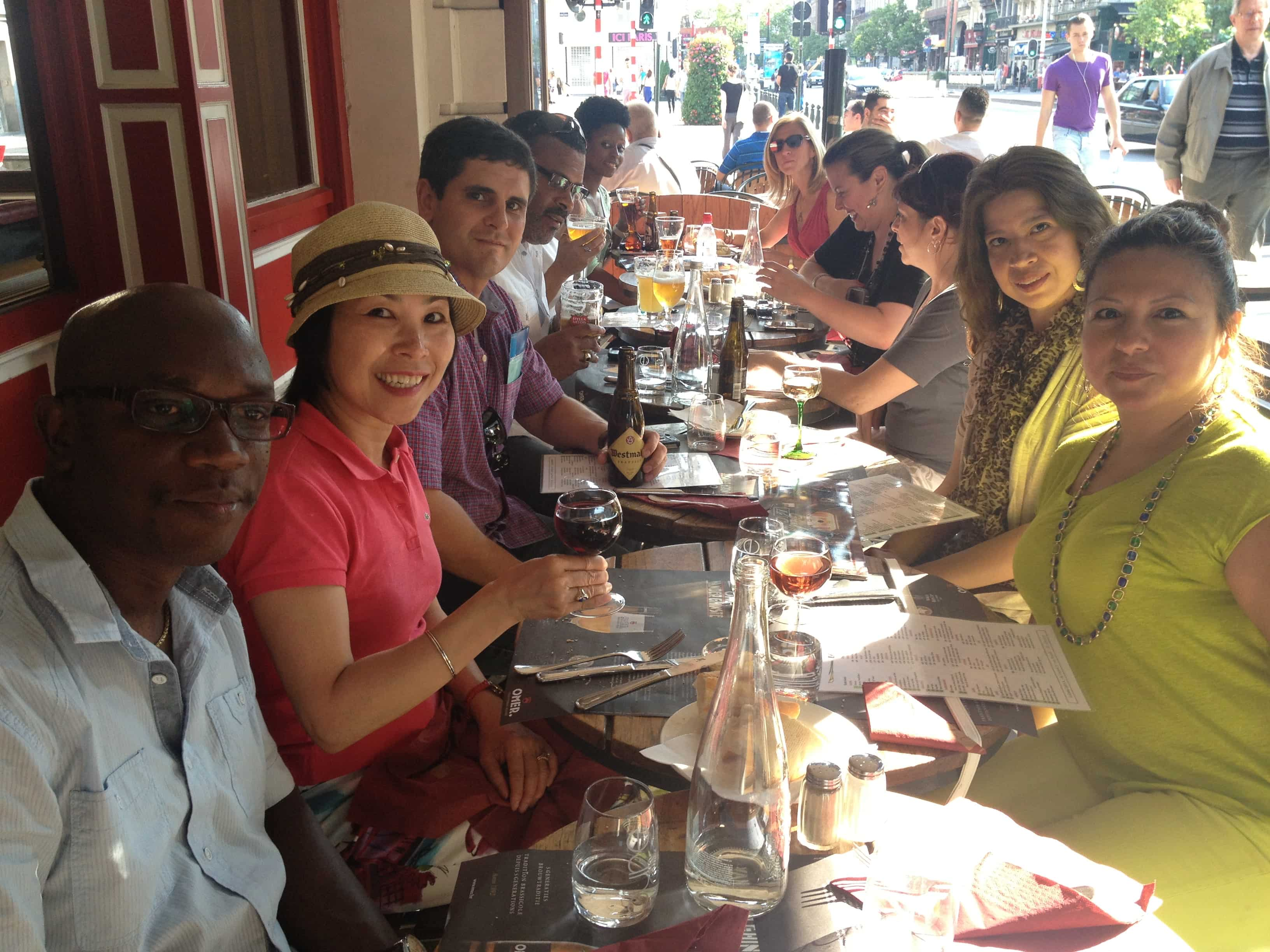 Students seated at a table for a meal in Brussels