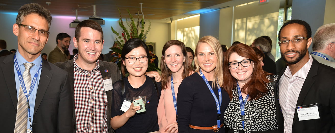 SPA Public Administration PhD Students standing together at event.
phd in public policy