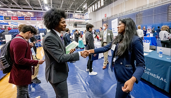 Student meeting potential employer at AU career fair