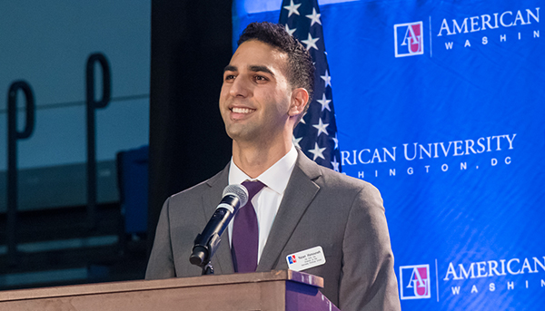 Student speaking at a podium